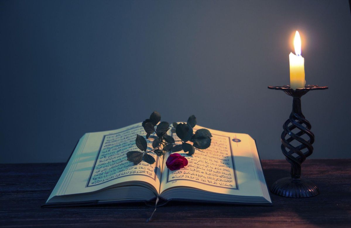 Quran with wooden stand and prayer beads arranged beautifully